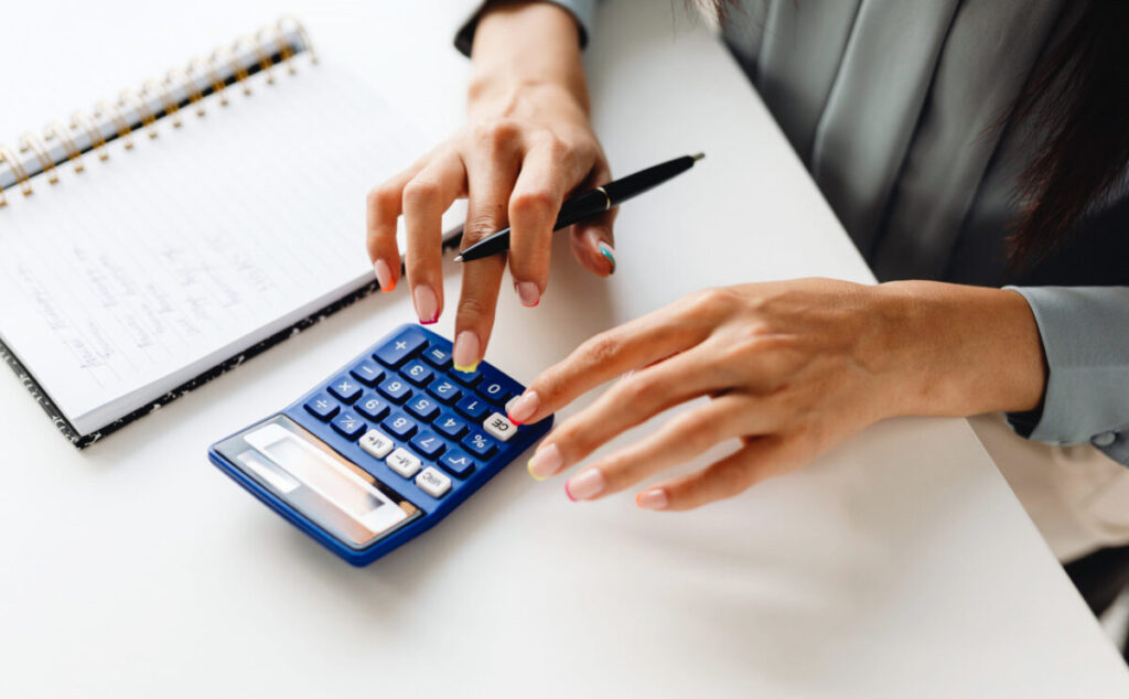 A-woman-calculating-with-a-calculator